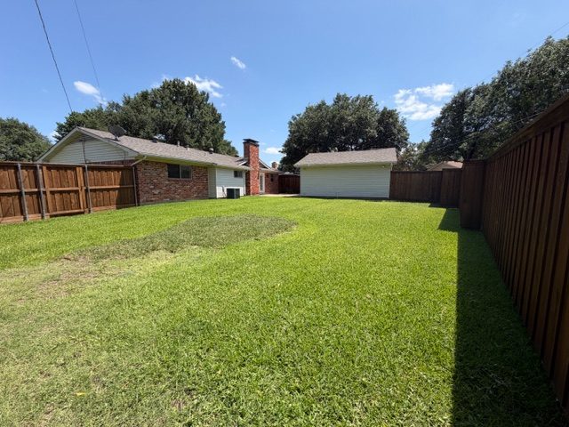 Backyard & detached garage at 2021 Sandy Trail